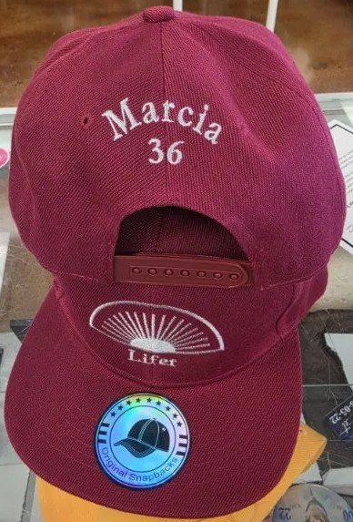 Custom name and number embroidery on hat in Indianapolis
